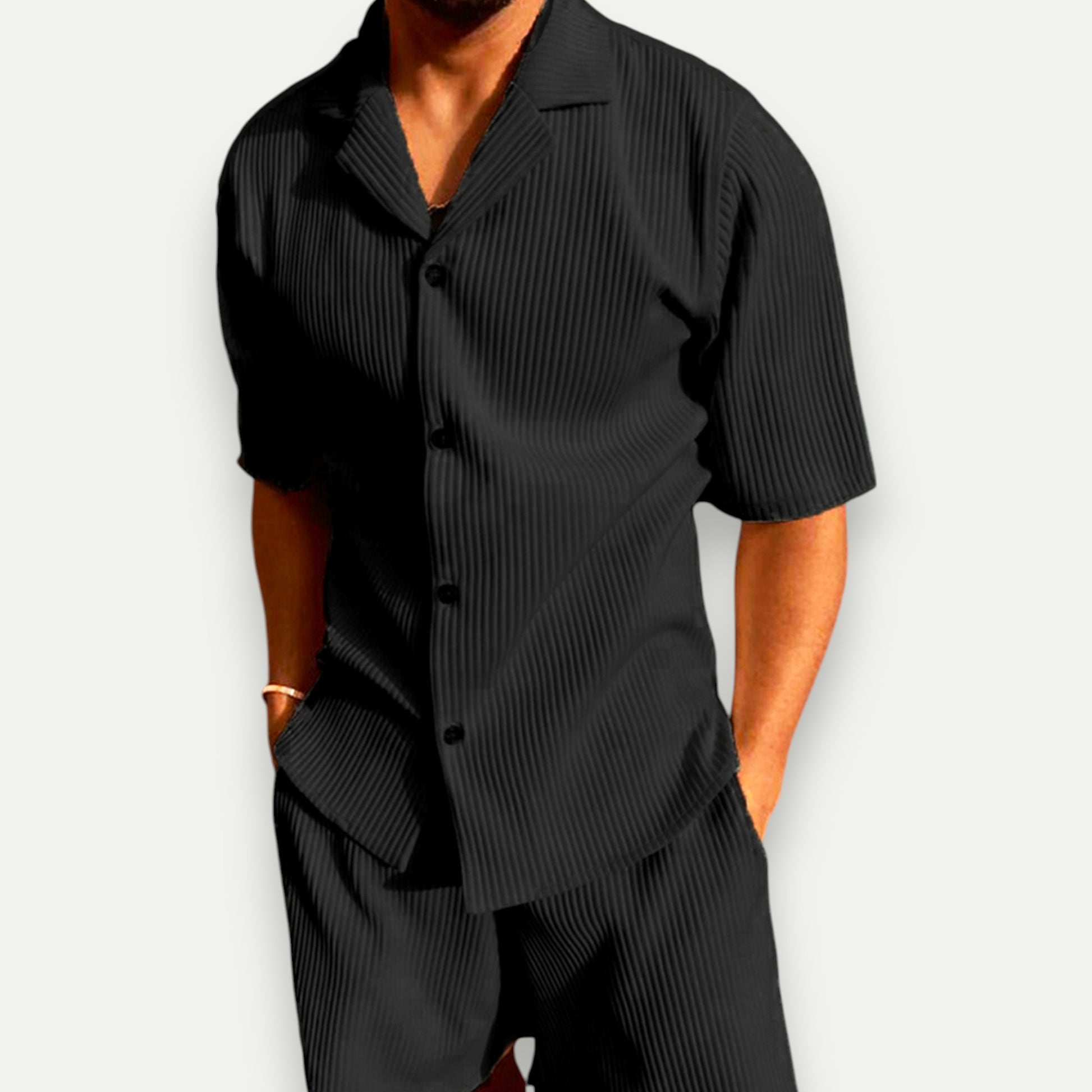 Men's corduroy polo set in black featuring a short-sleeve shirt and matching shorts for a stylish look
