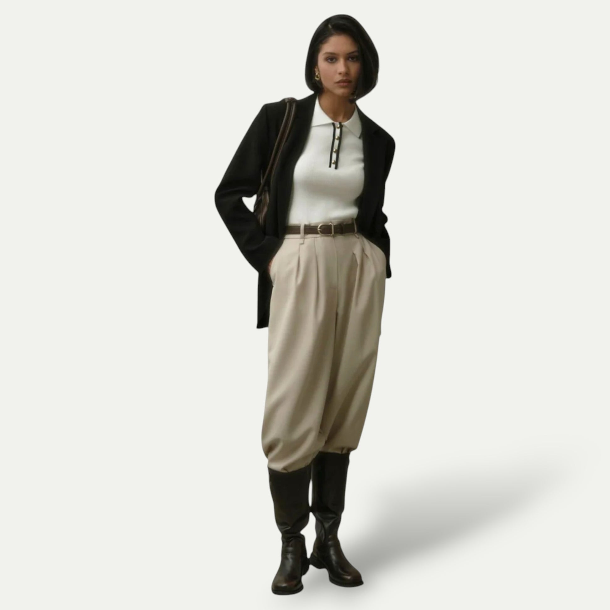 Stylish women's cropped polo shirt paired with high-waisted pants and a blazer for a modern look